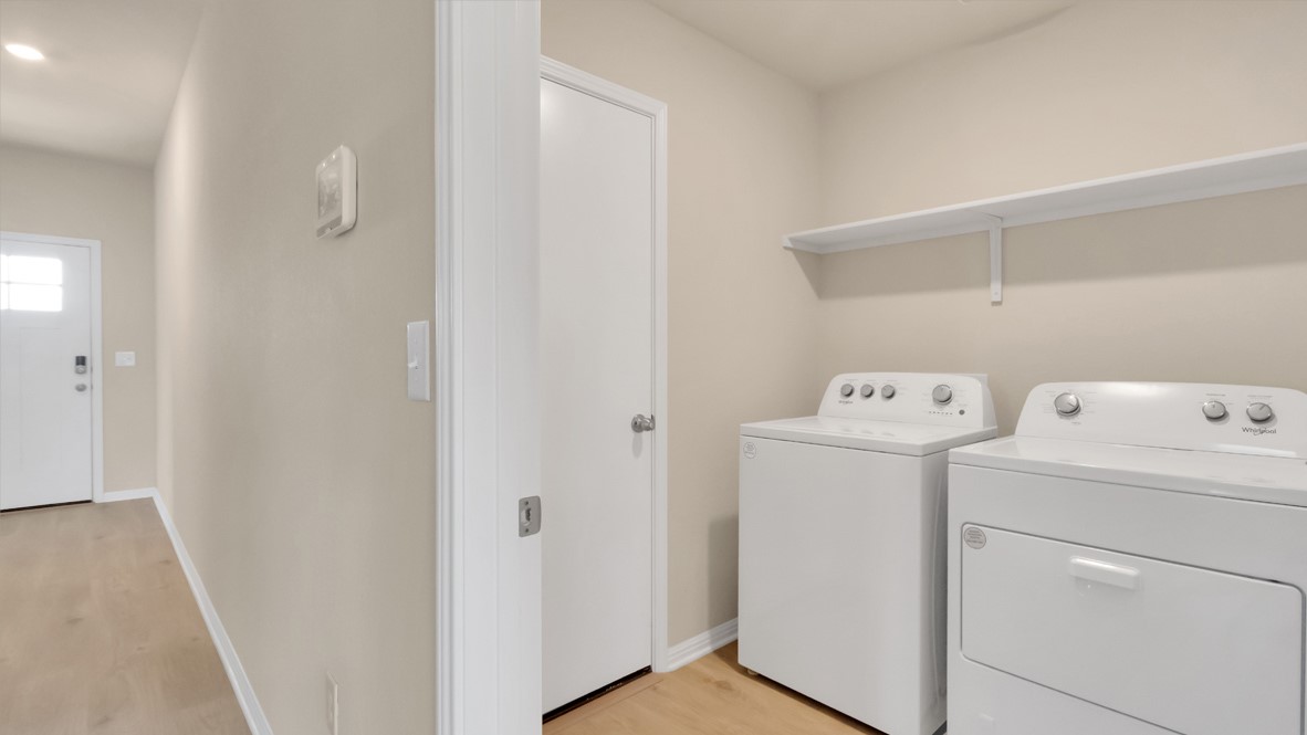 1817 Side Buster Trail Leander, TX 78641 - Photo 12 of 25 a view of storage and utility room with washer and dryer