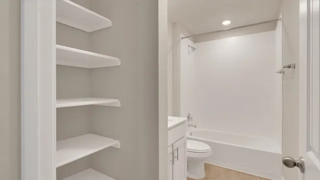 a bathroom with a shower and a toilet
