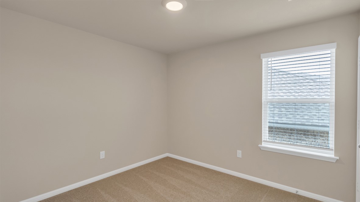 1817 Side Buster Trail Leander, TX 78641 - Photo 6 of 25 a view of an empty room with a window