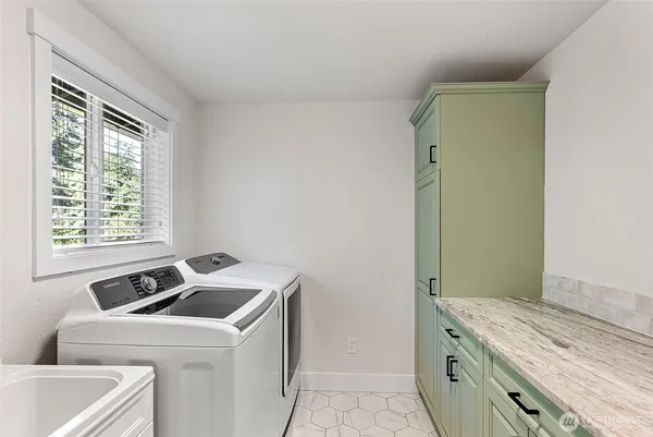 a utility room with dryer and washer