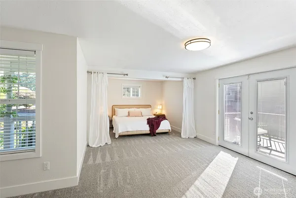 a bed room with a bed and a window