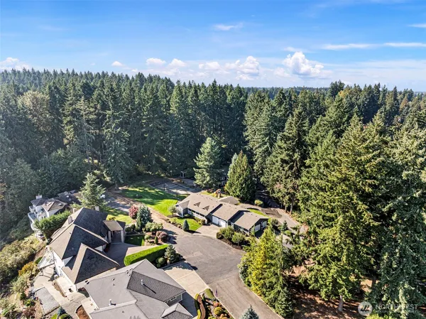 a view of a house with a yard and sitting area