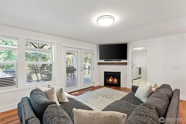 a living room with furniture and a fireplace