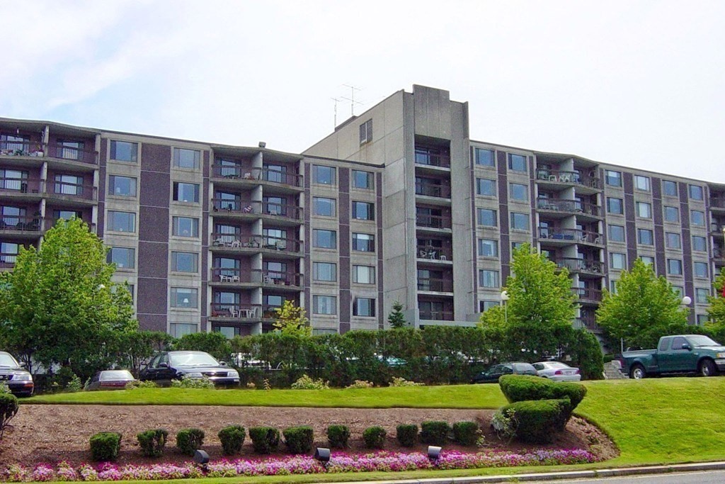 a front view of building with yard