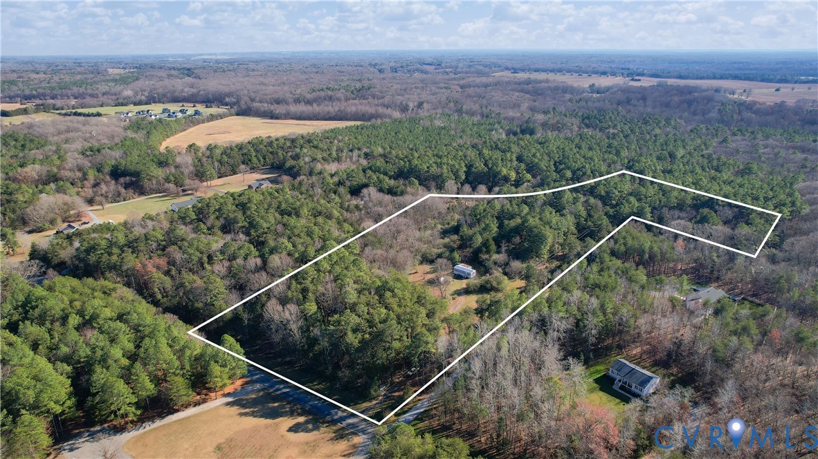 an aerial view of residential house with outdoor space