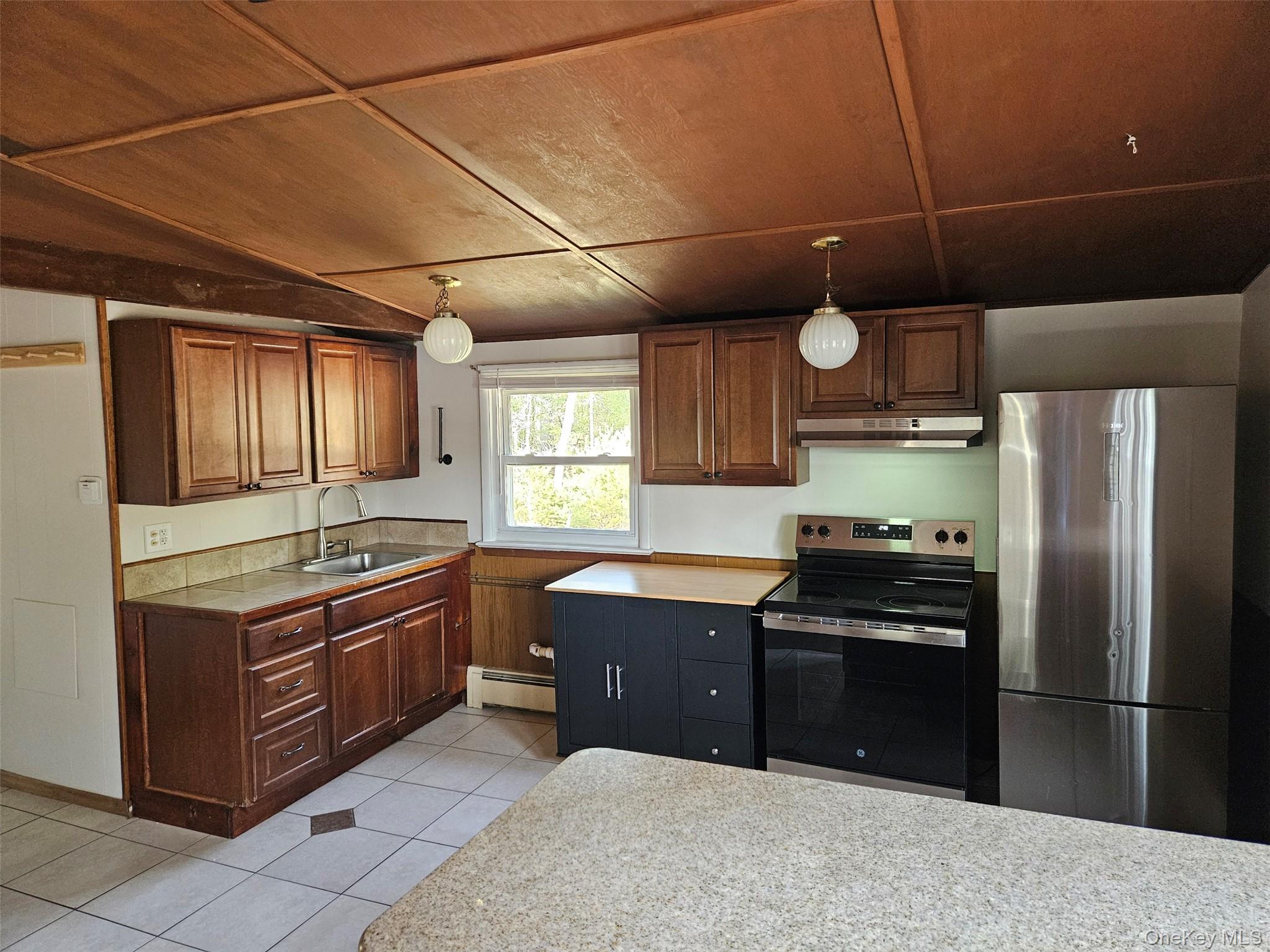 639 State Rte 55, Unit 2 Eldred, NY 12732 - Photo 11 of 11 a kitchen with stainless steel appliances granite countertop a stove a refrigerator and a sink