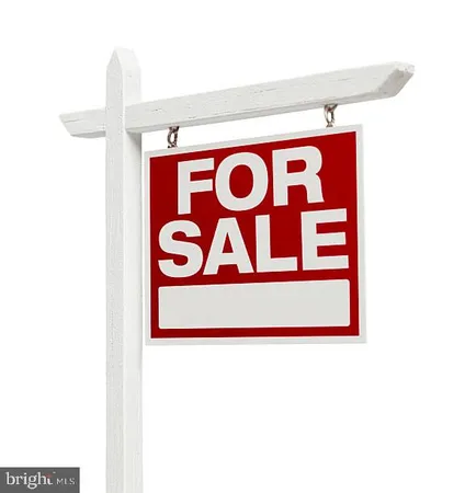 a wall with sign broad