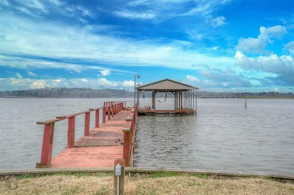 a view of a balcony with wooden floor