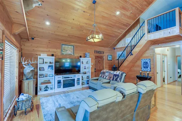 a living room with furniture and a flat screen tv