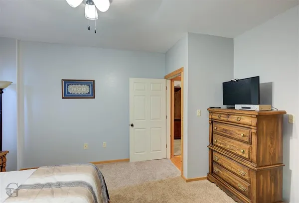 a bedroom with a bed and furniture