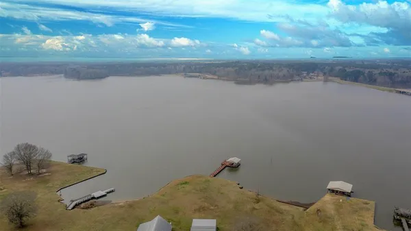 a bathroom with a granite countertop sink and vanity