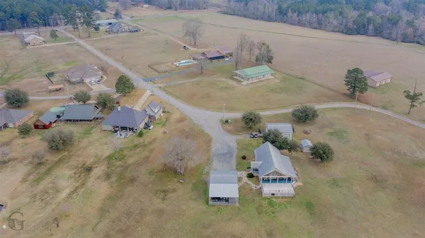 an aerial view of a house with outdoor space