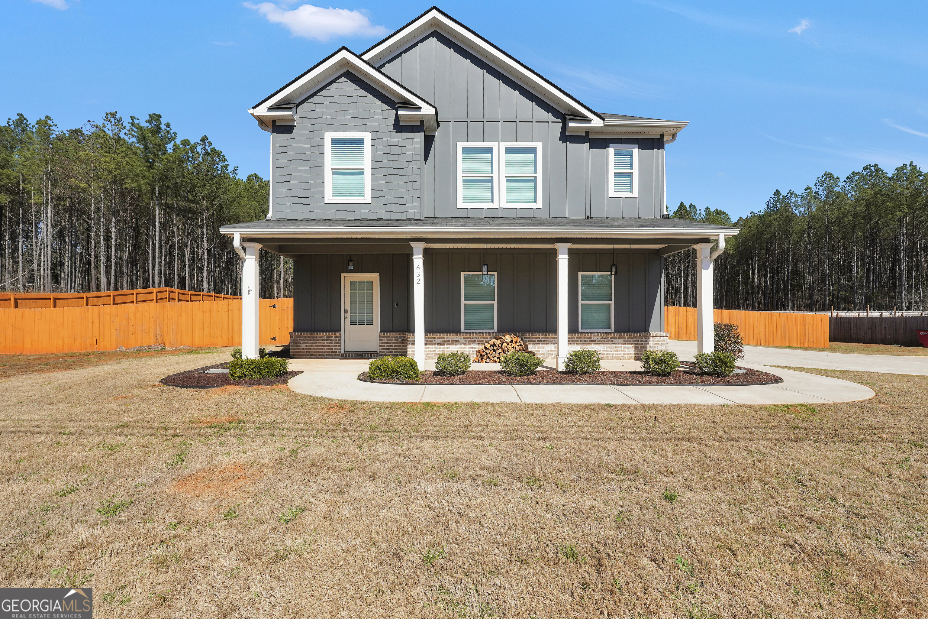632 Sutton Road Forsyth, GA 31029 - Photo 1 of 1 front view of a house with a yard