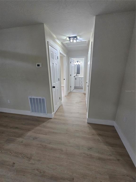 567 School Street Bronson, FL 32621 - Photo 12 of 23 a view of a hallway view with wooden floor