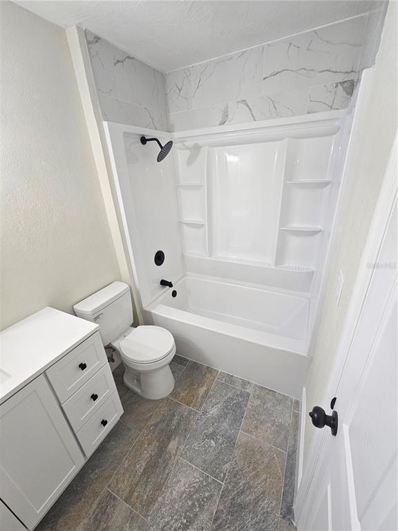 567 School Street Bronson, FL 32621 - Photo 15 of 23 a bathroom with a toilet a sink and a bathtub