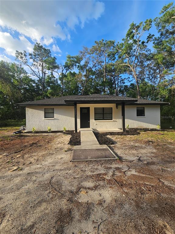 567 School Street Bronson, FL 32621 - Photo 3 of 23 front view of a house with a yard
