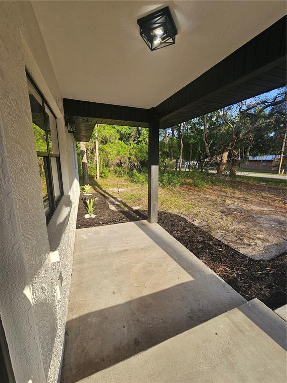 567 School Street Bronson, FL 32621 - Photo 5 of 23 a view of a living room and floor to ceiling window