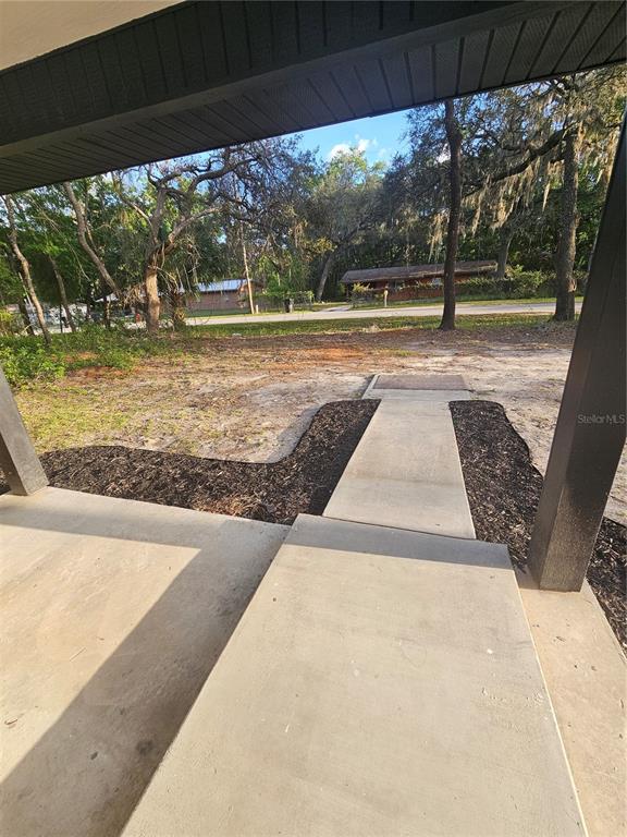 567 School Street Bronson, FL 32621 - Photo 6 of 23 a view of swimming pool with a yard