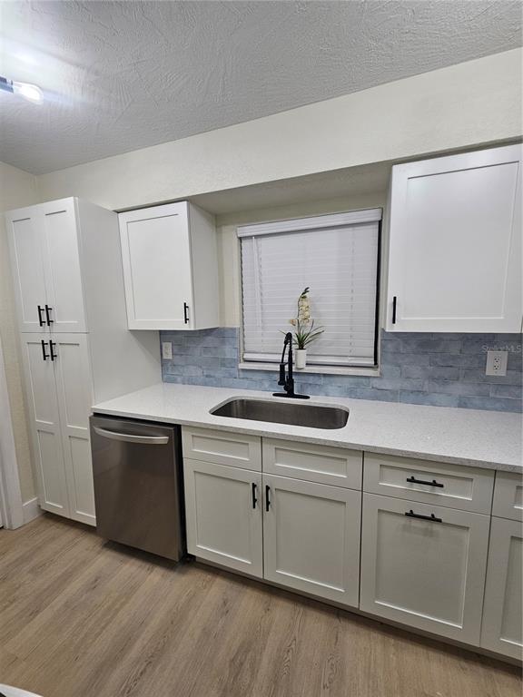 567 School Street Bronson, FL 32621 - Photo 8 of 23 a kitchen with white cabinets and sink