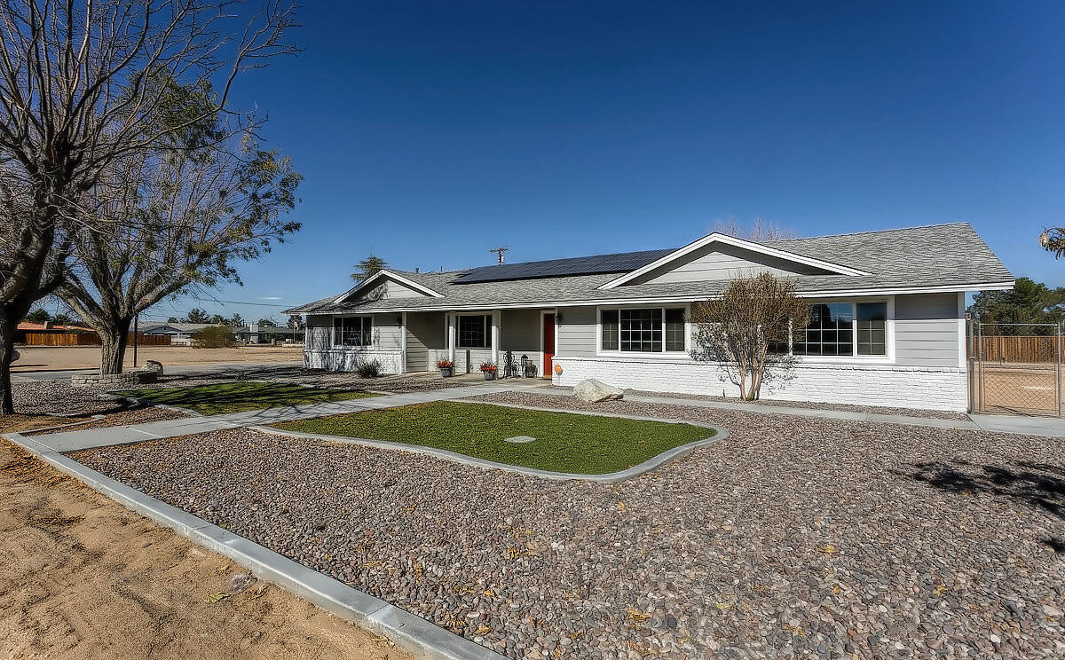 20140 Sahale Road Apple Valley, CA 92307 - Photo 3 of 45 a front view of a house with swimming pool