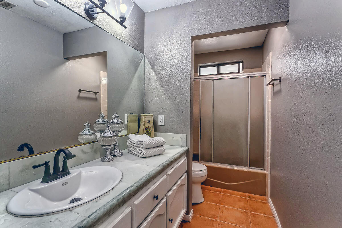 20140 Sahale Road Apple Valley, CA 92307 - Photo 31 of 45 a bathroom with double vanity sinks and a mirror