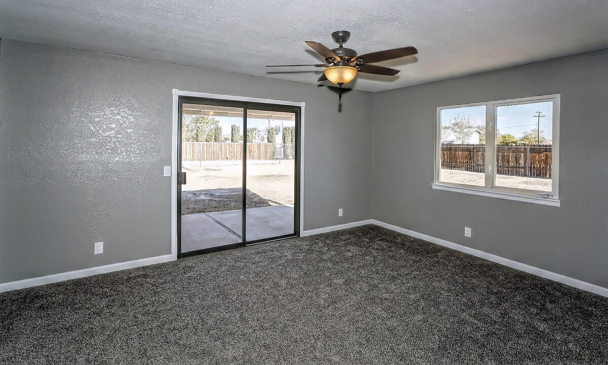 20140 Sahale Road Apple Valley, CA 92307 - Photo 35 of 45 a view of a livingroom with an empty space and a window