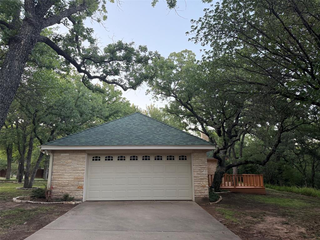 150 Timberidge Lake Road Graham, TX 76450 - Photo 4 of 25 a front view of a house with a tree