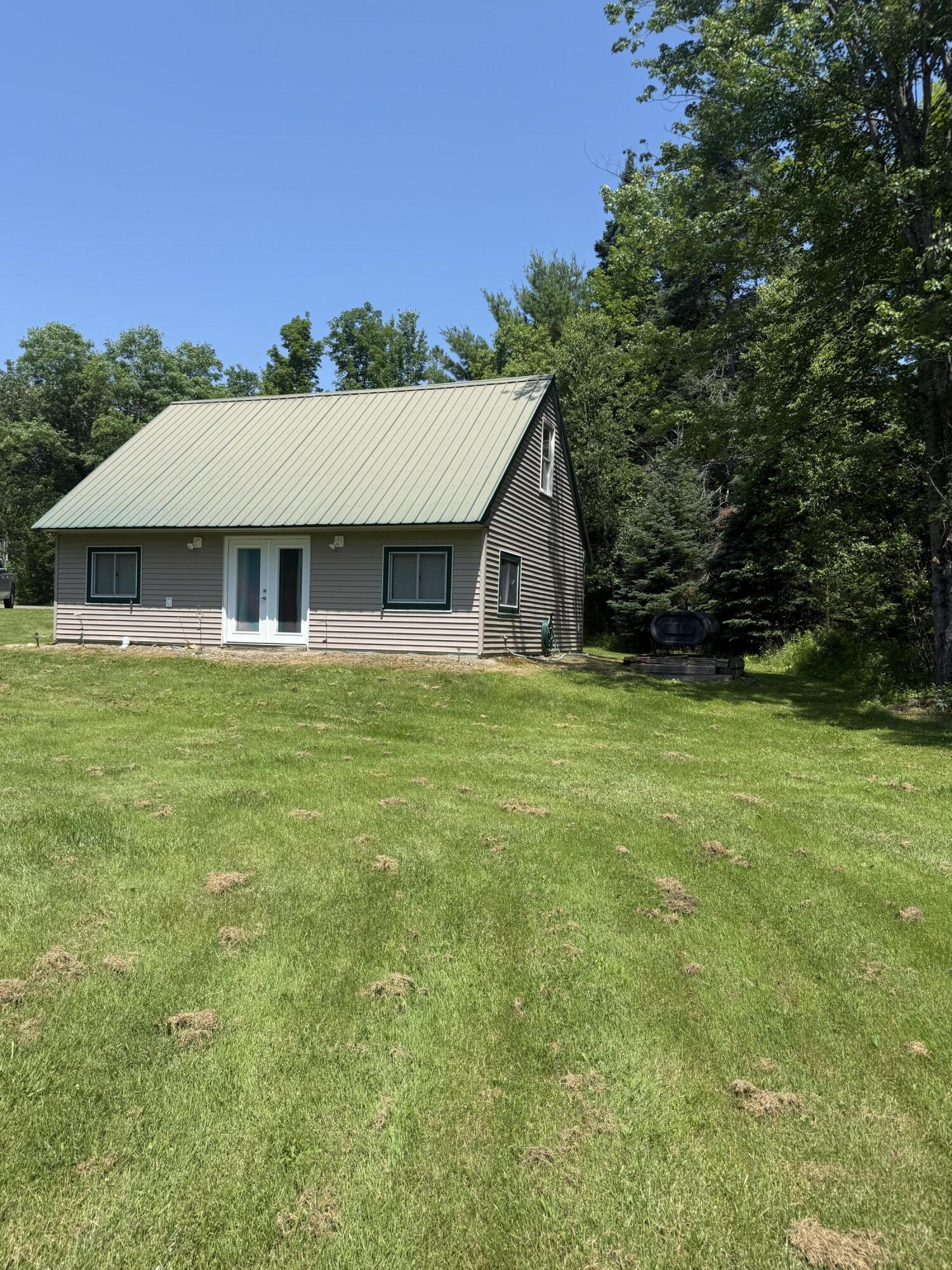 161 Bond Road Corinna, ME 04928 - Photo 2 of 39 back side view of lawn
