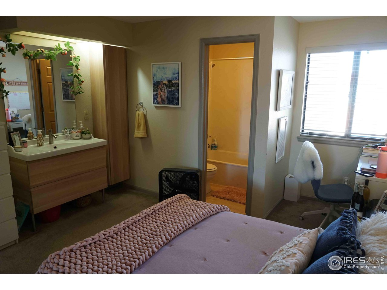 903 18th Street, Unit 302 Boulder, CO 80302 - Photo 7 of 10 a bedroom with a bed and wooden floor