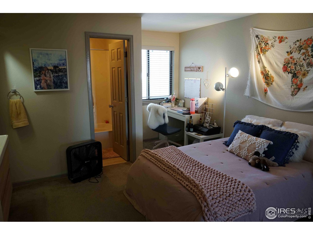 903 18th Street, Unit 302 Boulder, CO 80302 - Photo 8 of 10 a bedroom with a bed and a mirror