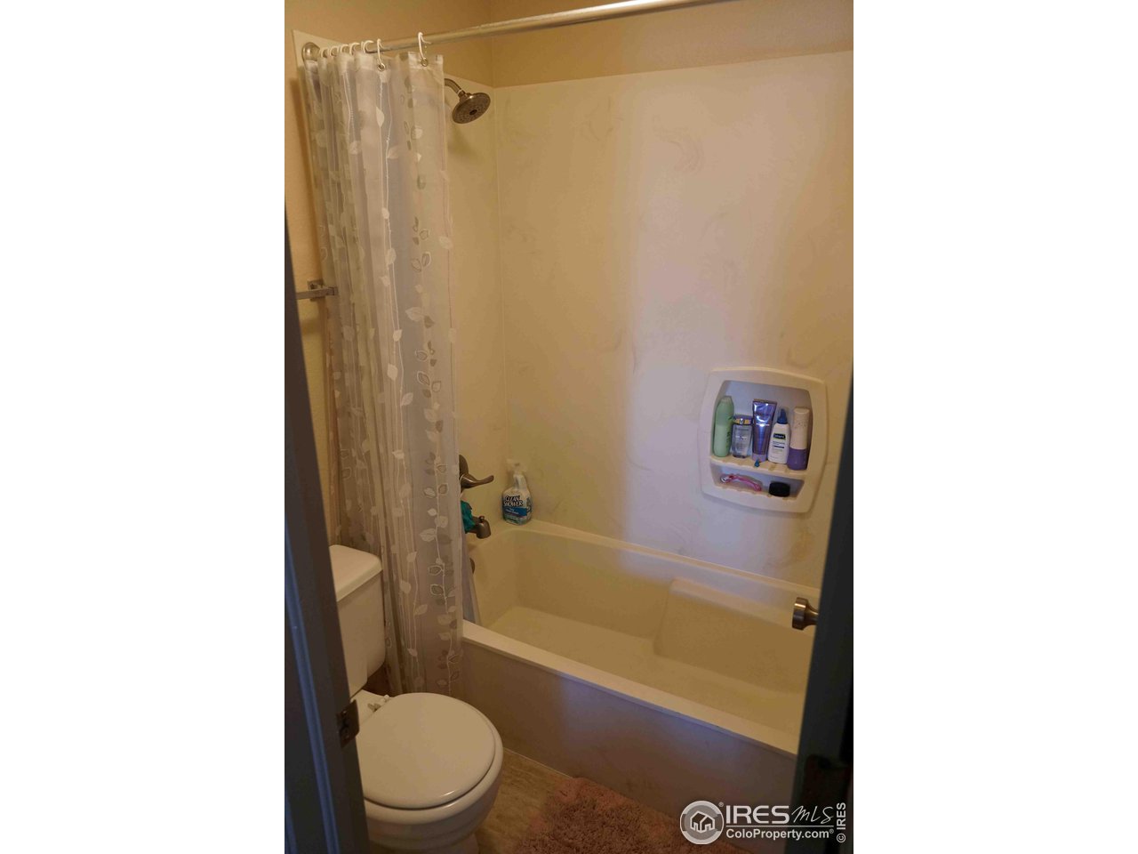 903 18th Street, Unit 302 Boulder, CO 80302 - Photo 9 of 10 a bathroom with a sink a toilet and shower
