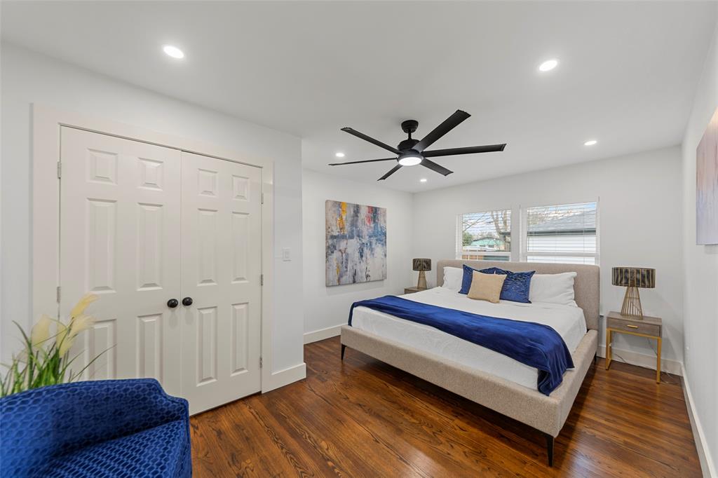 2945 Healey Drive Dallas, TX 75228 - Photo 11 of 38 a bed room with a bed and a ceiling fan