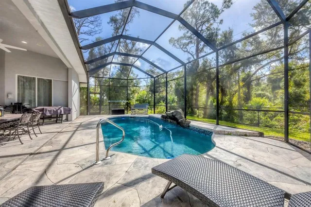 a view of a swimming pool with a patio