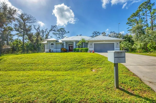 a view of a house with a yard
