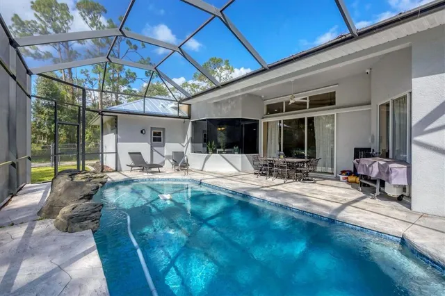 a view of swimming pool with patio