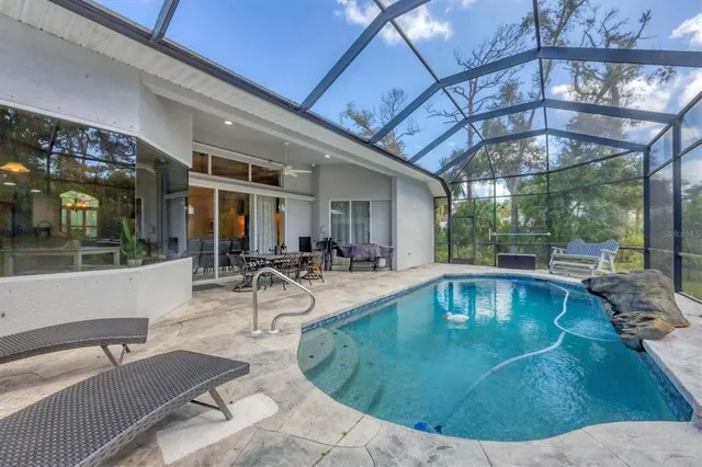 a view of a swimming pool with a patio
