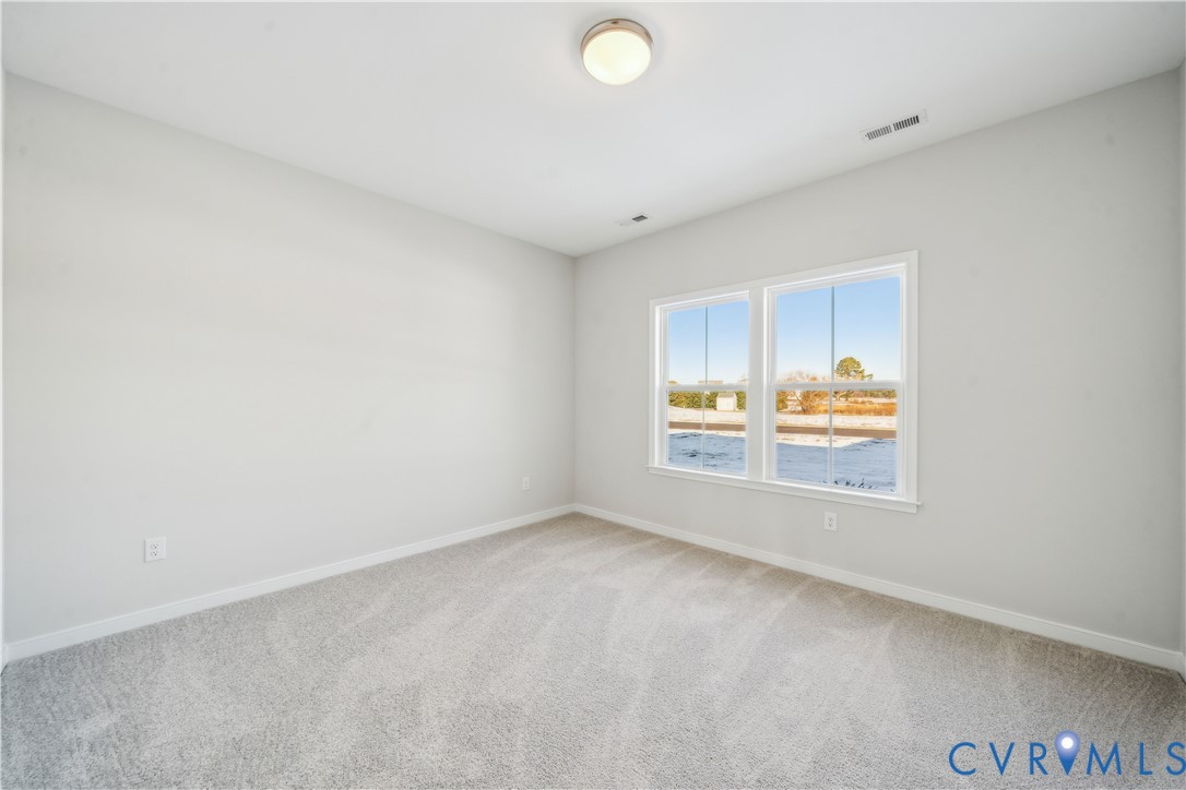 115 Logan Way Tappahannock, VA 22560 - Photo 12 of 29 an empty room with windows