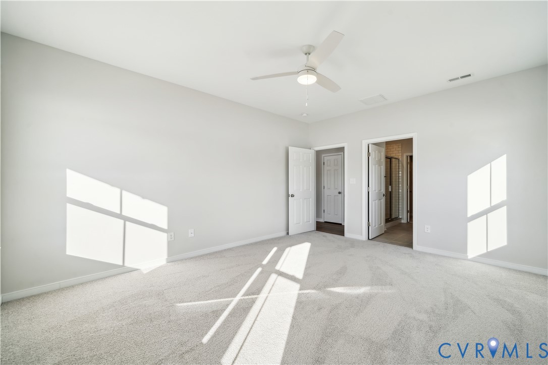 115 Logan Way Tappahannock, VA 22560 - Photo 18 of 29 an empty room with windows and closet