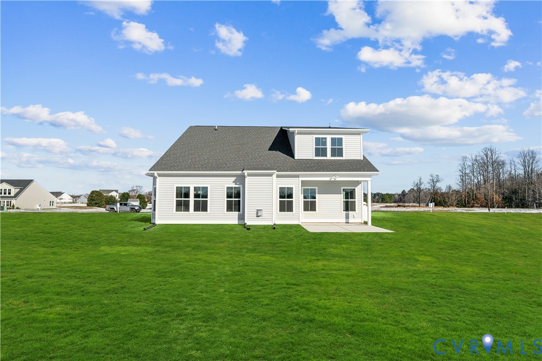 115 Logan Way Tappahannock, VA 22560 - Photo 28 of 29 a front view of a house with a garden