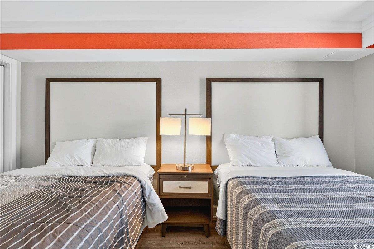 7200 North Ocean Boulevard, Unit 1155 Myrtle Beach, SC 29572 - Photo 15 of 40 Bedroom featuring wood finished floors