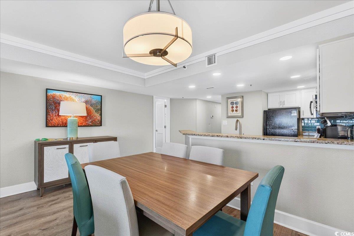 7200 North Ocean Boulevard, Unit 1155 Myrtle Beach, SC 29572 - Photo 32 of 40 Dining space with light wood-style flooring, recessed lighting, and crown molding
