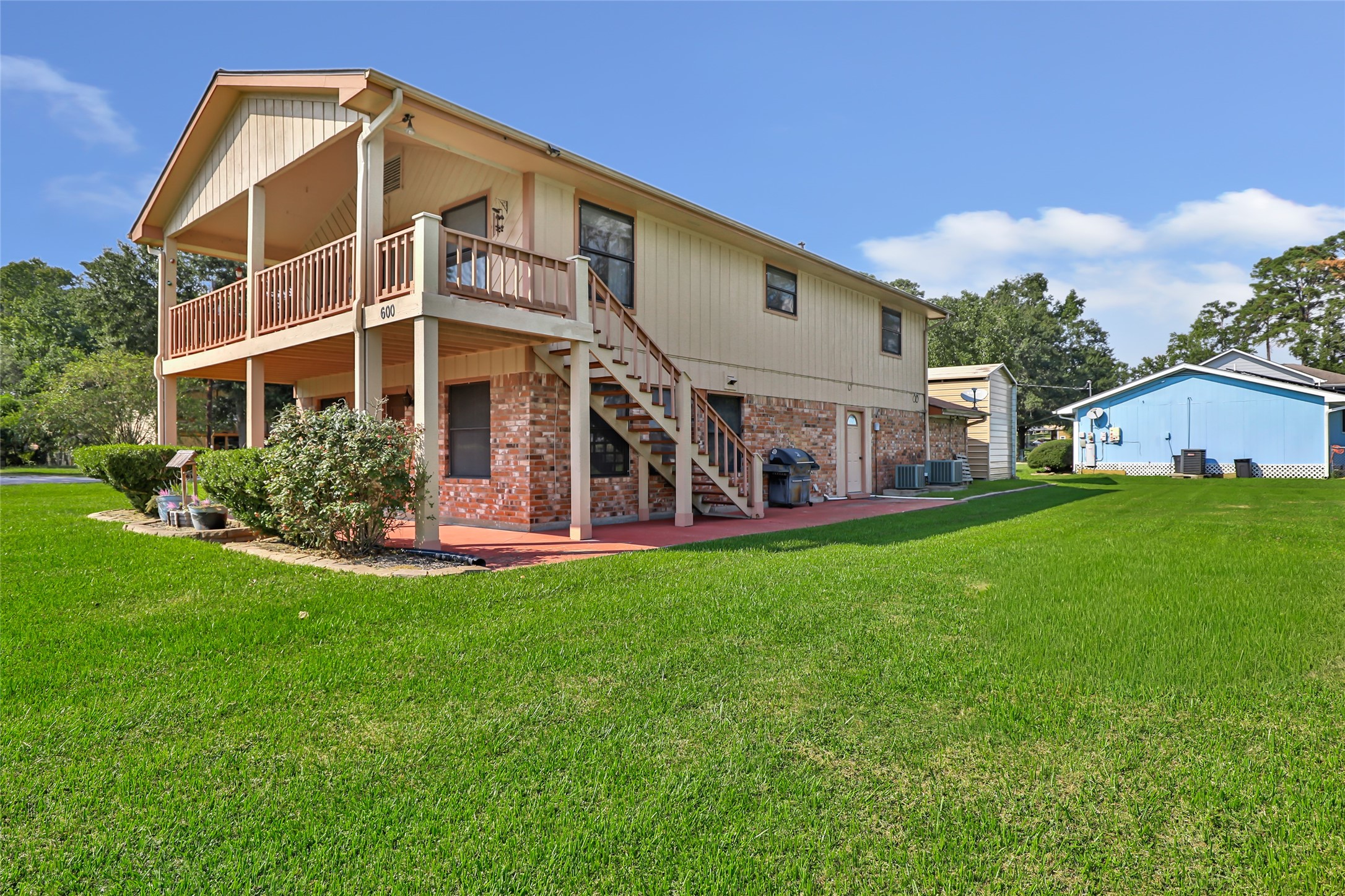 600 Sam Houston Loop Point Blank, TX 77364 - Photo 1 of 28 a view of a house with a yard
