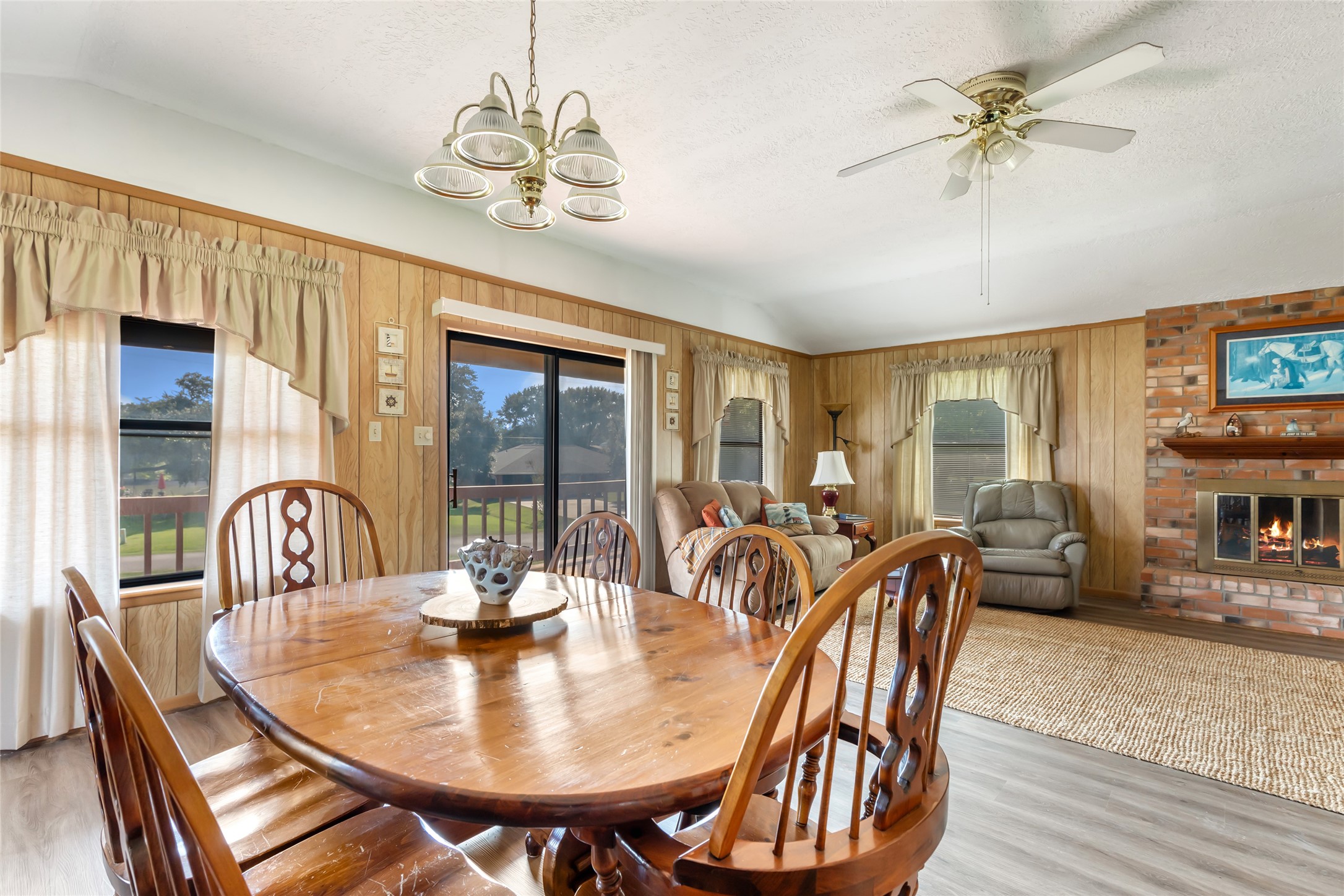 600 Sam Houston Loop Point Blank, TX 77364 - Photo 11 of 28 a dining room with furniture a chandelier and wooden floor