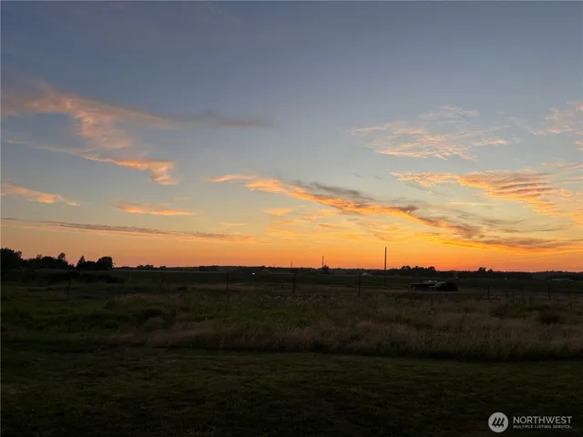 a view of an ocean and a mountain