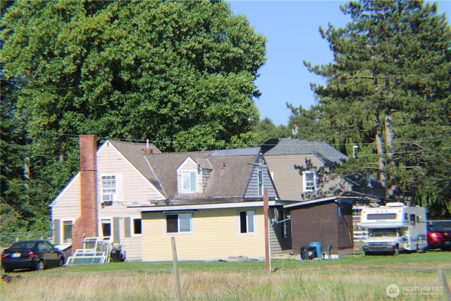 an aerial view of a house with a yard