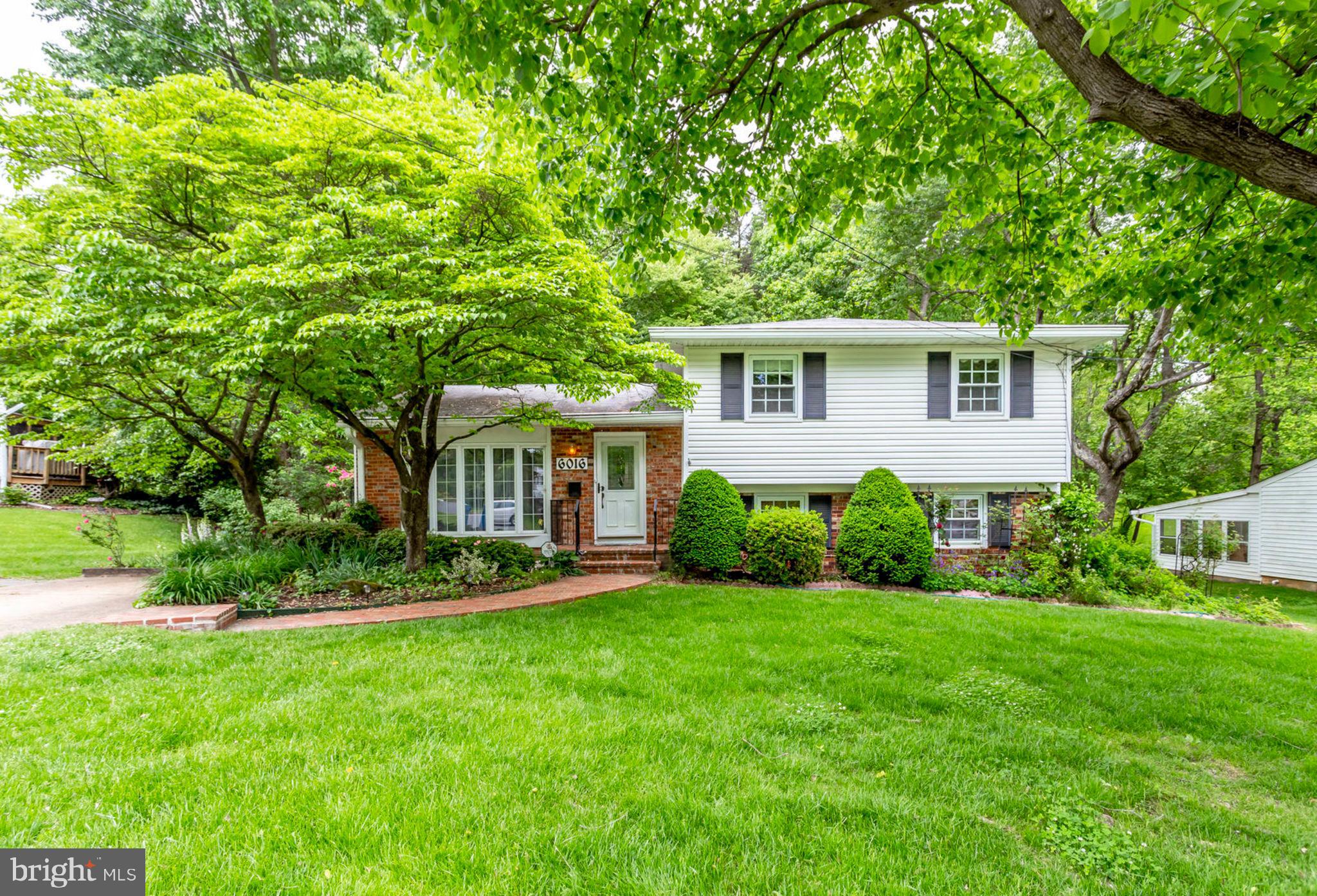 6016 Craft Road Alexandria, VA 22310 - Photo 2 of 32 front view of a house with a yard
