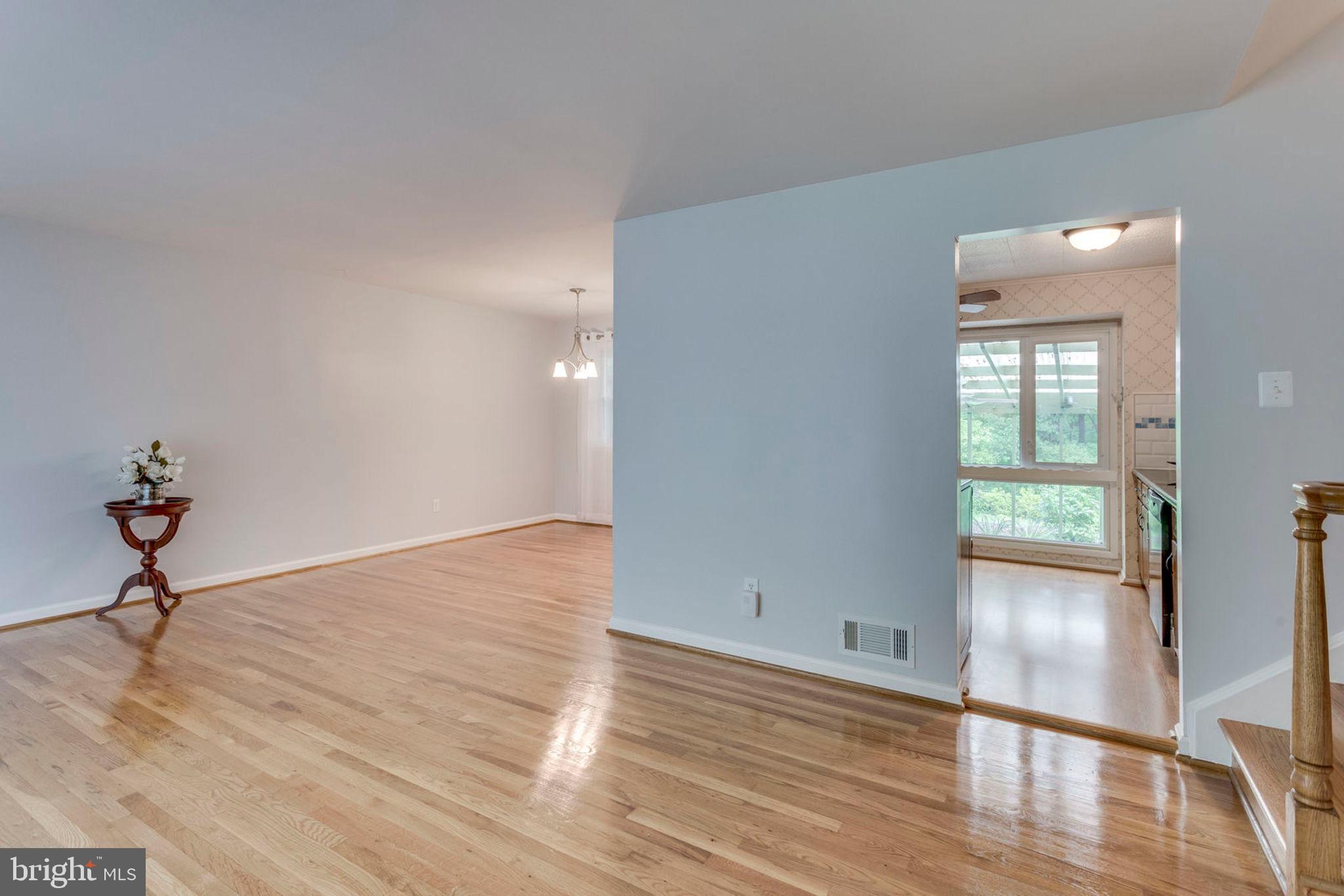 6016 Craft Road Alexandria, VA 22310 - Photo 5 of 32 a view of empty room with wooden floor and fan