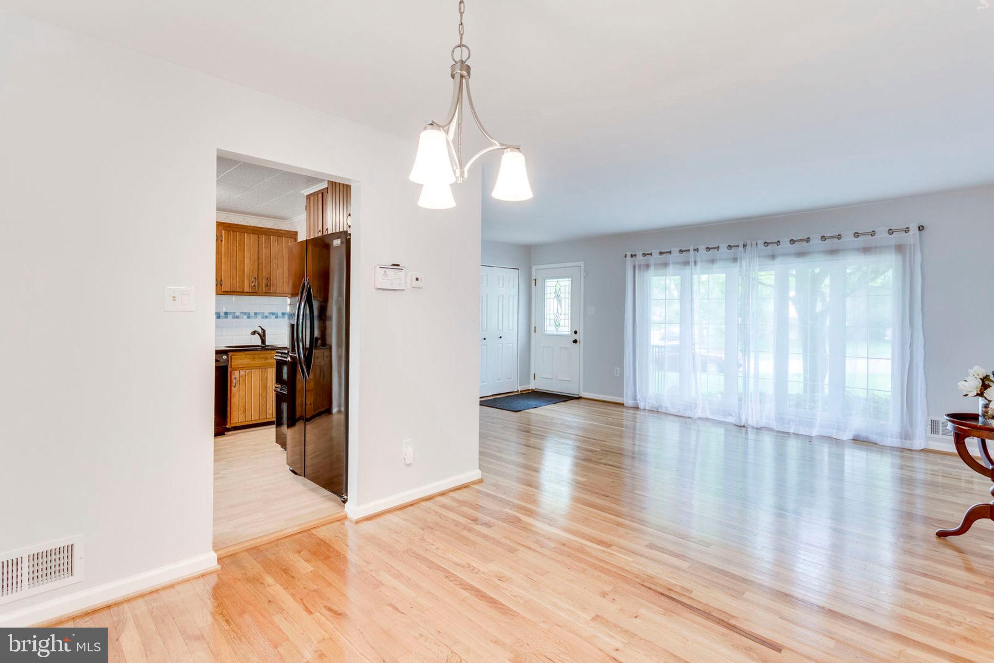 6016 Craft Road Alexandria, VA 22310 - Photo 8 of 32 a view of empty room with wooden floor and fan