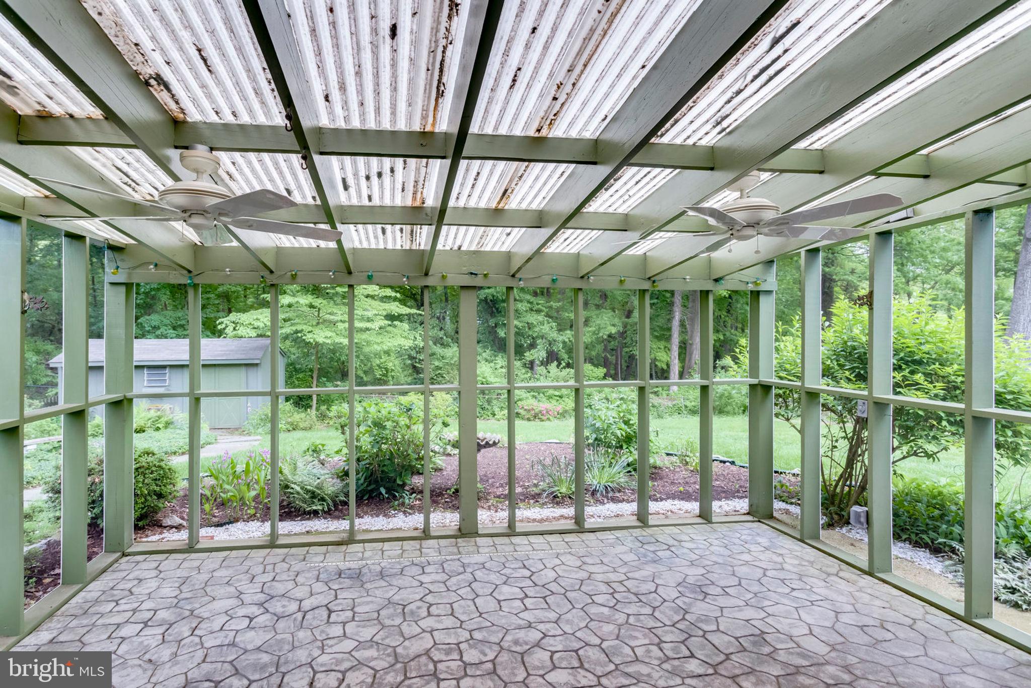 6016 Craft Road Alexandria, VA 22310 - Photo 10 of 32 a view of a porch with furniture and floor