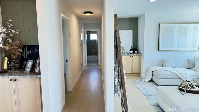 a living room with furniture and a flat tv screen